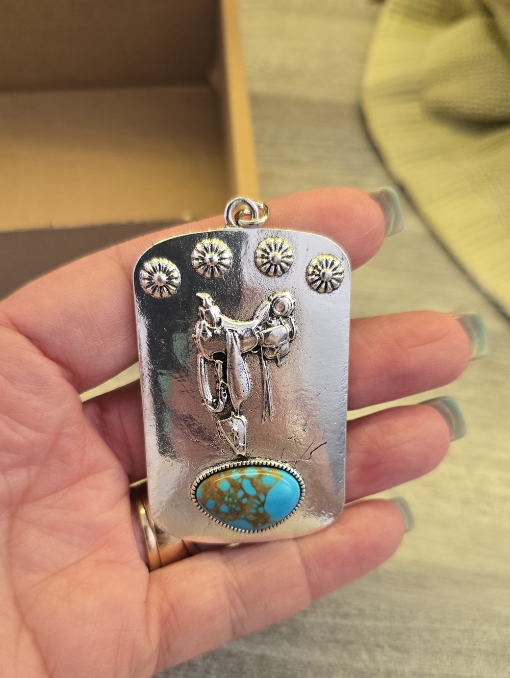 Silver Tone Western Saddle Pendant with Turquoise Stone